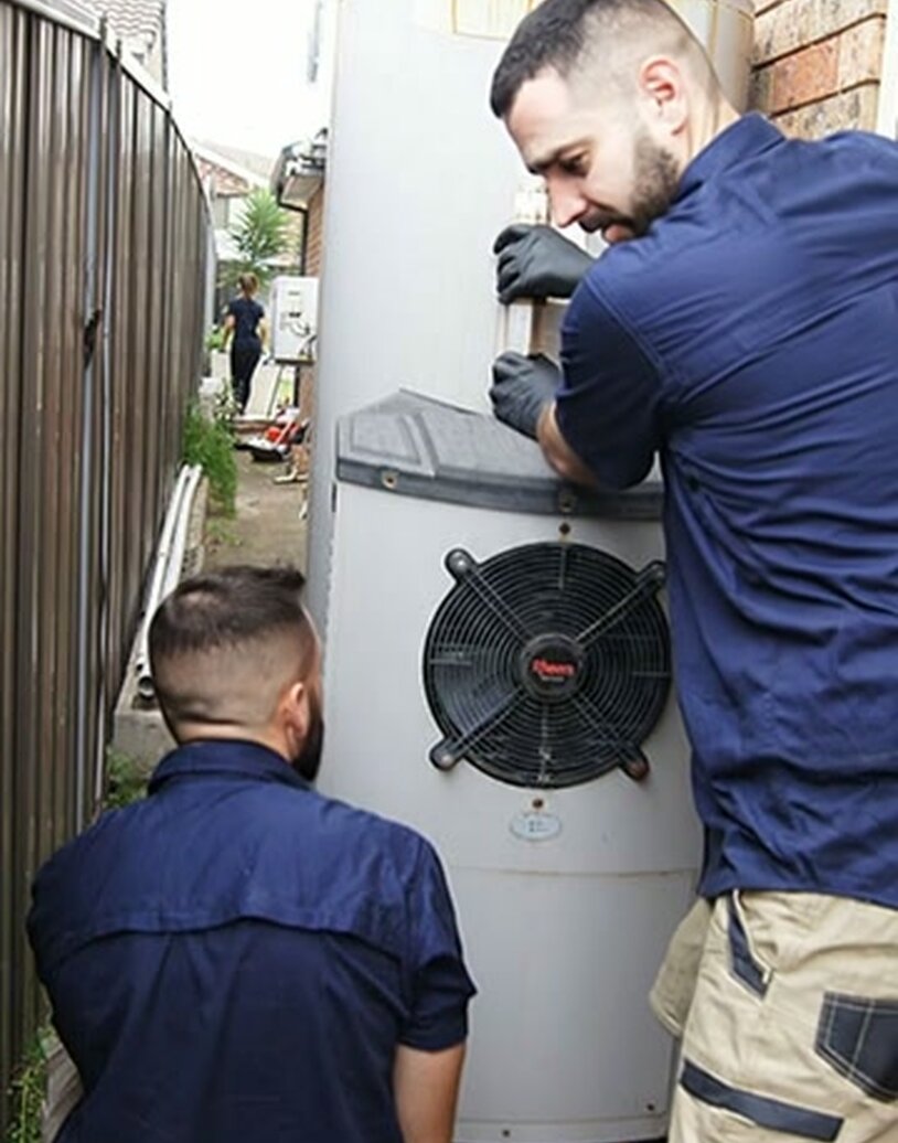 Fixed Today plumber installing a heat pump hot water system