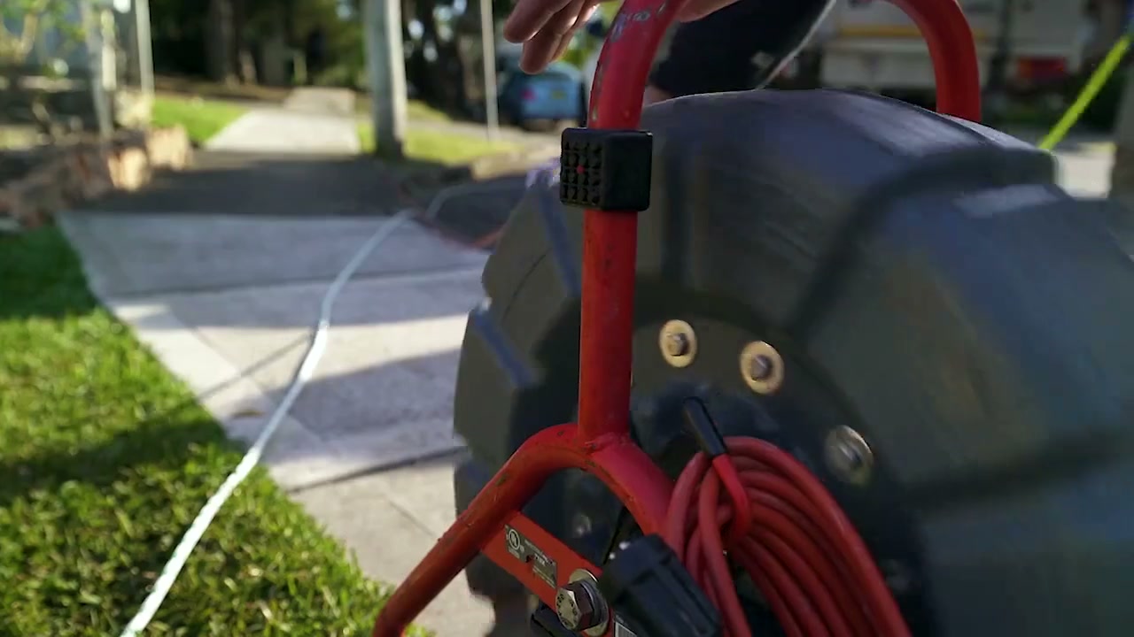 Drain jetting hose reel on a Sydney footpath