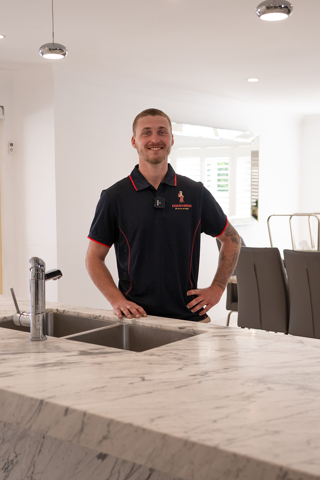 Fixed Today plumber at a kitchen sink in a Sydney home