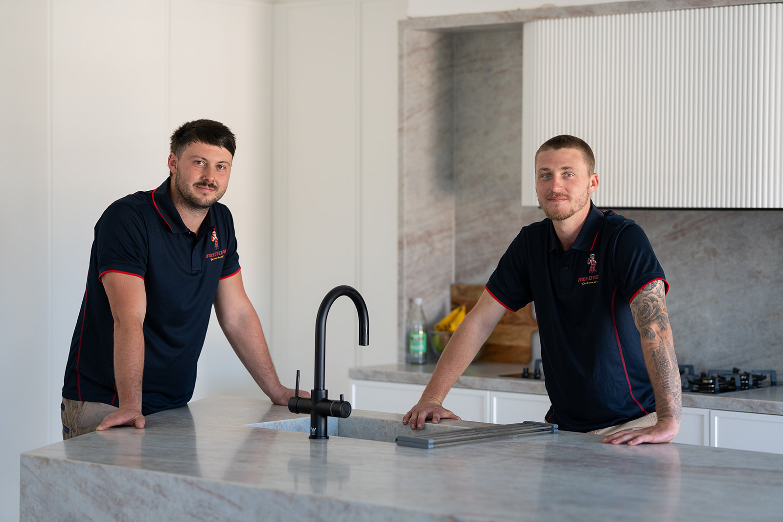 Two Fixed Today plumbers in a Sydney kitchen
